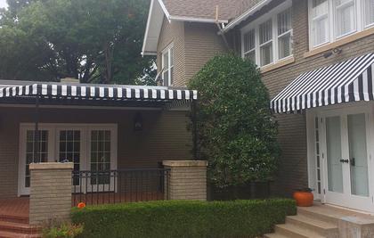 Striped awning over an outdoor patio