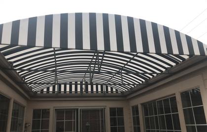 Large striped courtyard awning