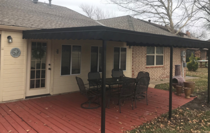 Custom patio cover installed over an outdoor deck