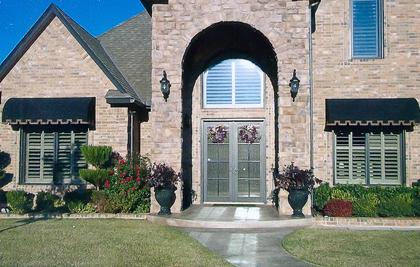 Custom residential awning installed above a home entrance